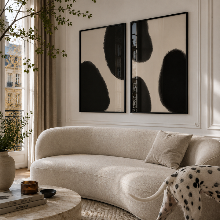 Modern living room with a beige sofa, abstract wall art, and decorative elements.