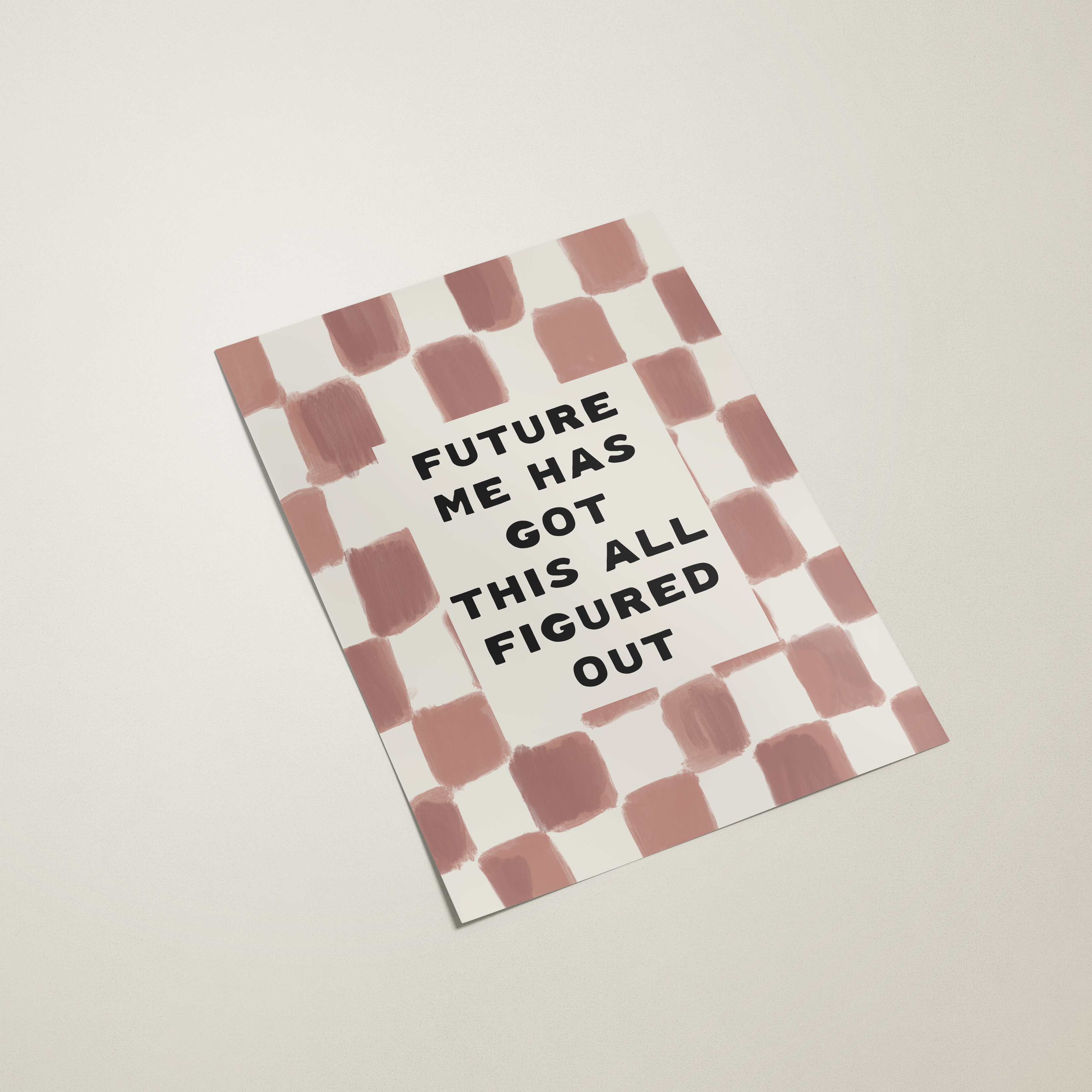 Notebook with striped design and text on a plain background