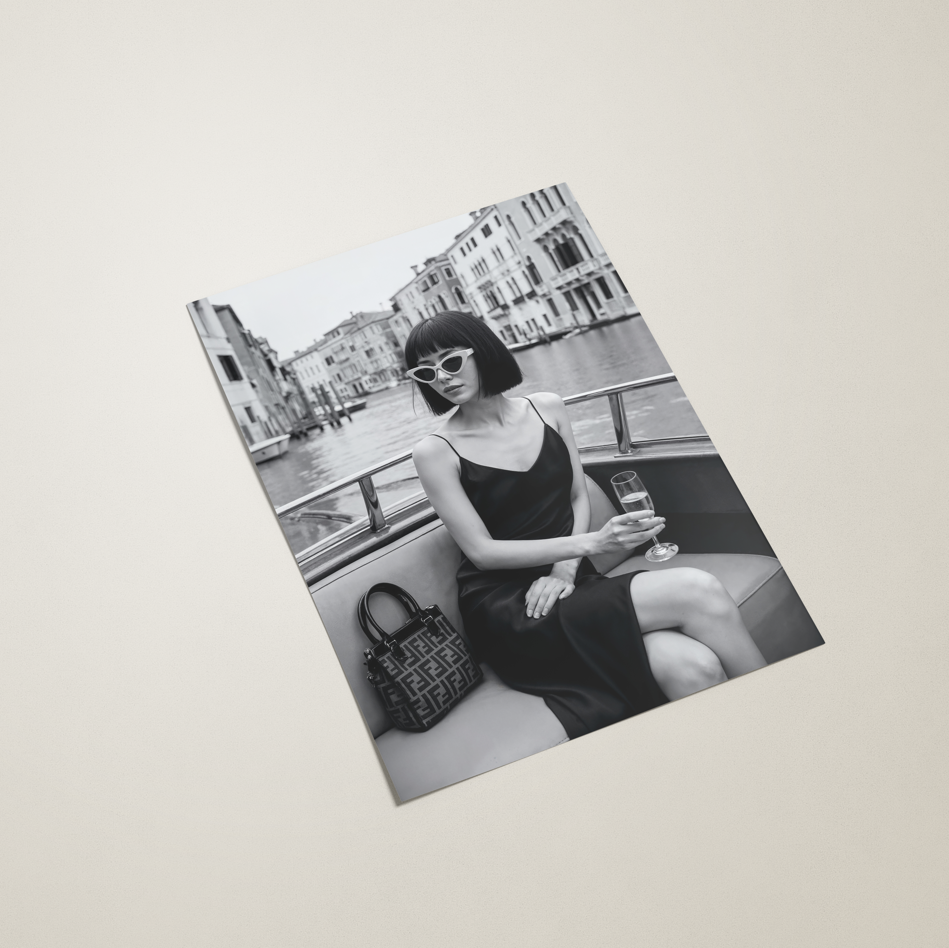 Photograph of a woman sitting on a boat with a cityscape in the background