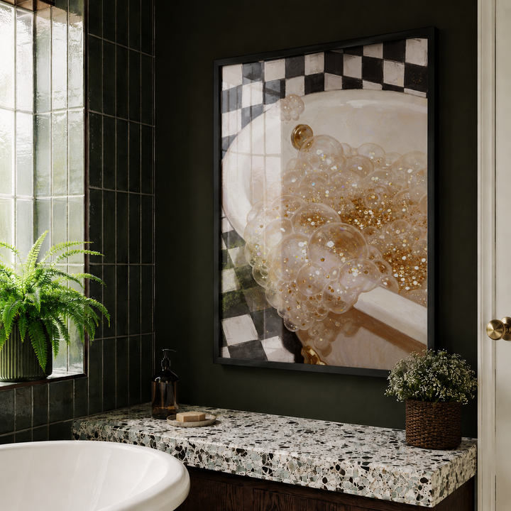 Bathroom with a framed artwork of a bathtub with bubbles, black tiled walls, and a window.