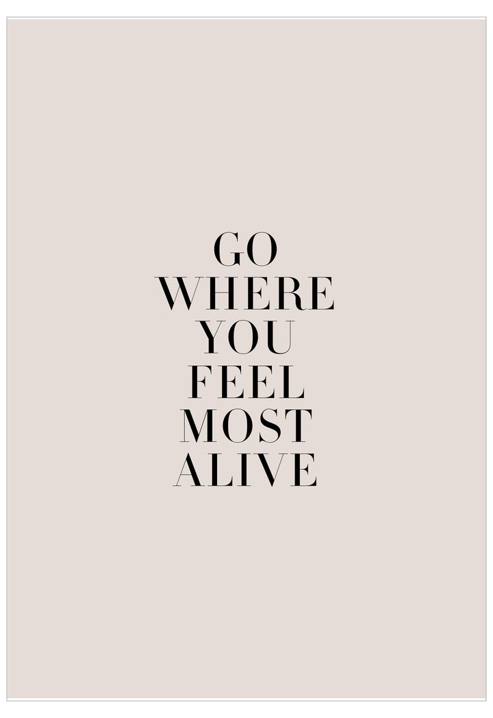 Motivational quote 'Go where you feel most alive' on a light pink background