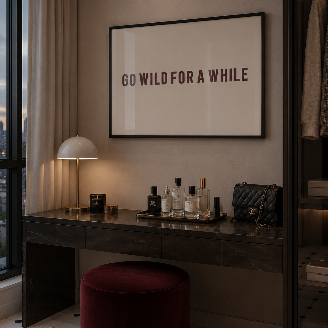 Modern interior with a desk, lamp, and framed quote on a wall.