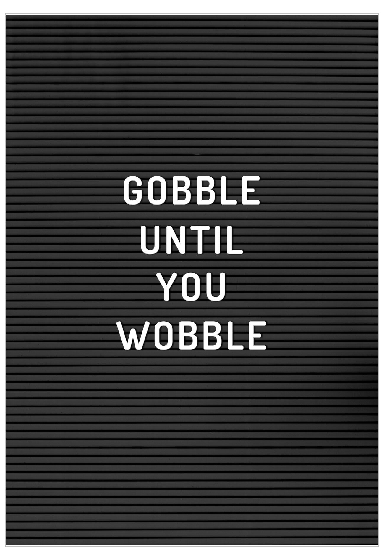 Black letter board with white text 'Gobble Until You Wobble' on a black background