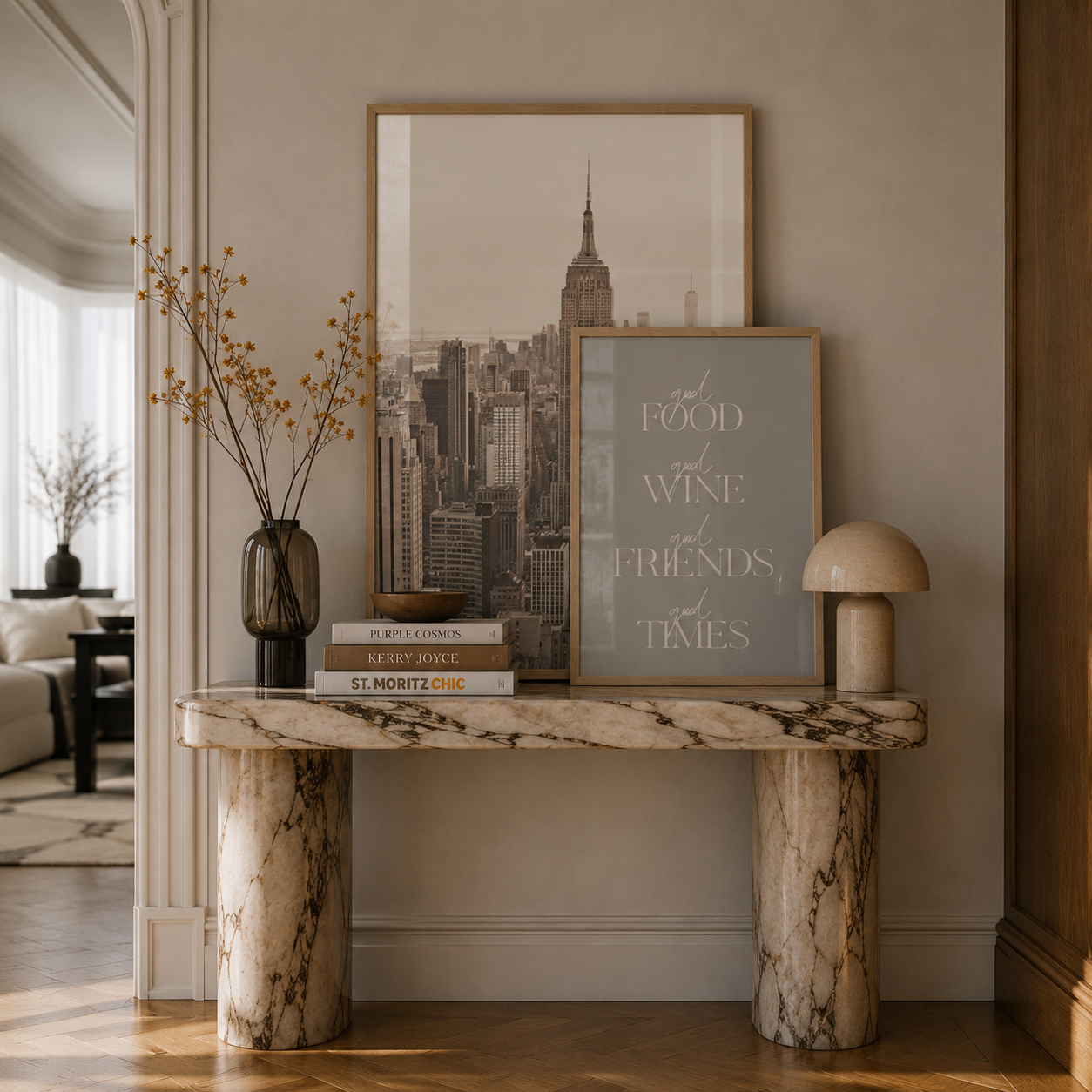 Marble console table with framed artwork and decor in a living room setting