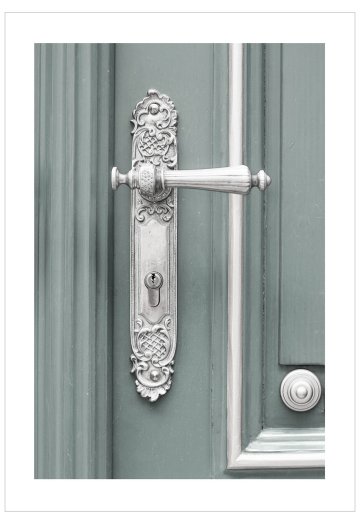 Decorative door handle on a green door