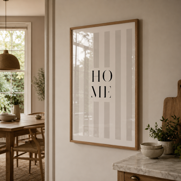Framed artwork with 'HOME' text in a modern interior setting.
