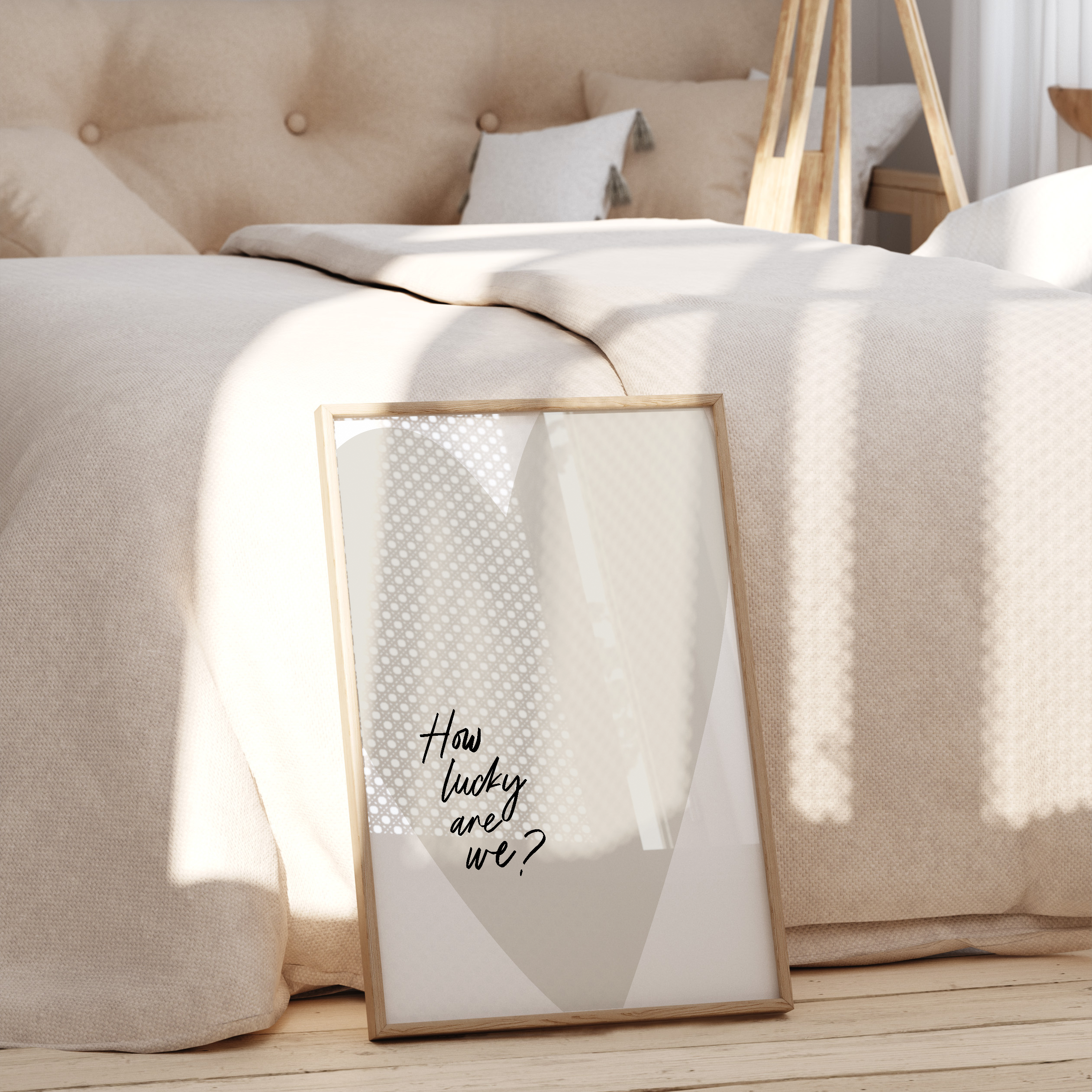 Framed artwork with text on a wooden surface in a bedroom setting