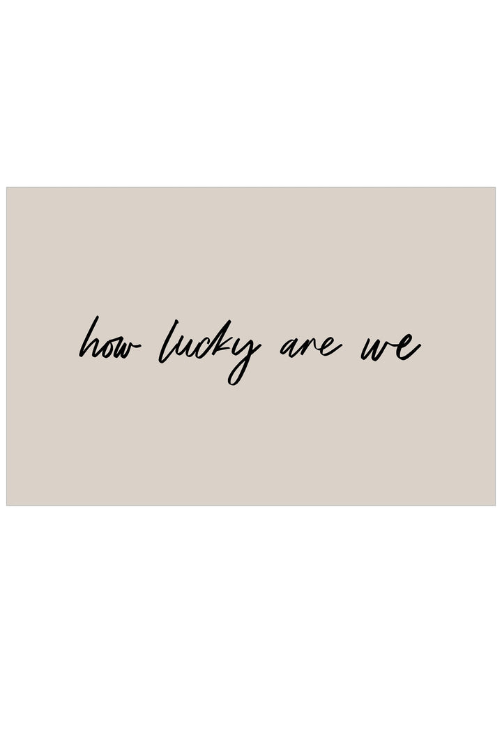 Text 'how lucky are we' on a beige background