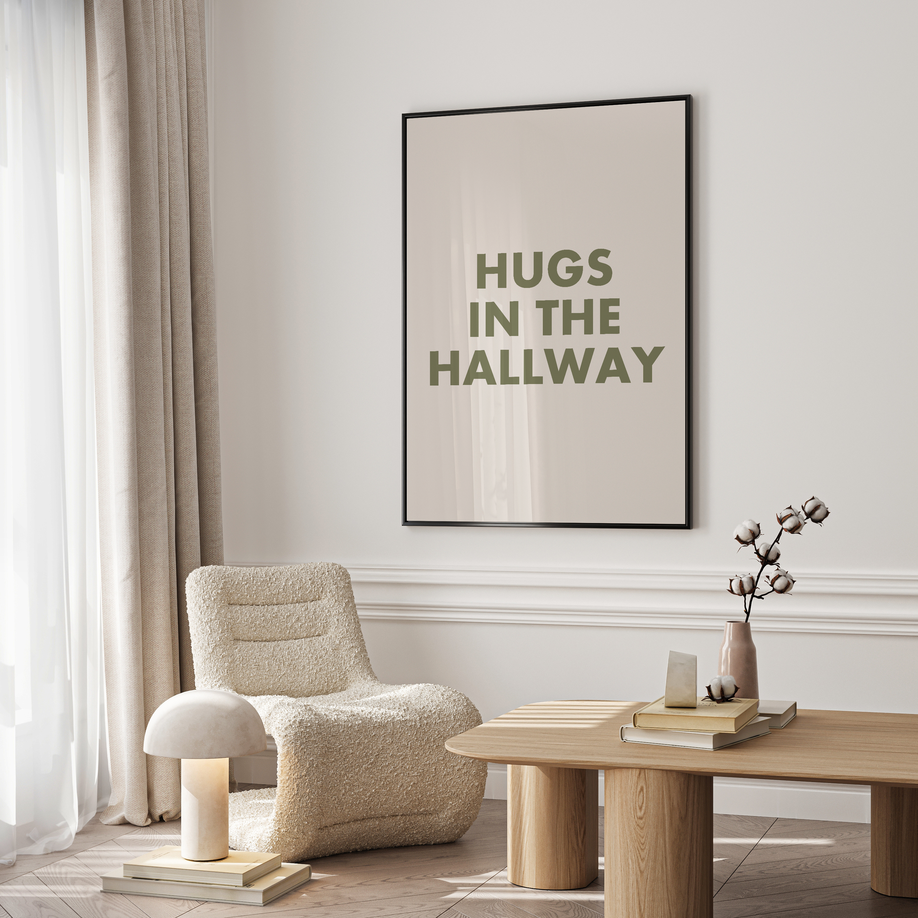 Modern living room with a chair, table, and framed artwork on the wall.