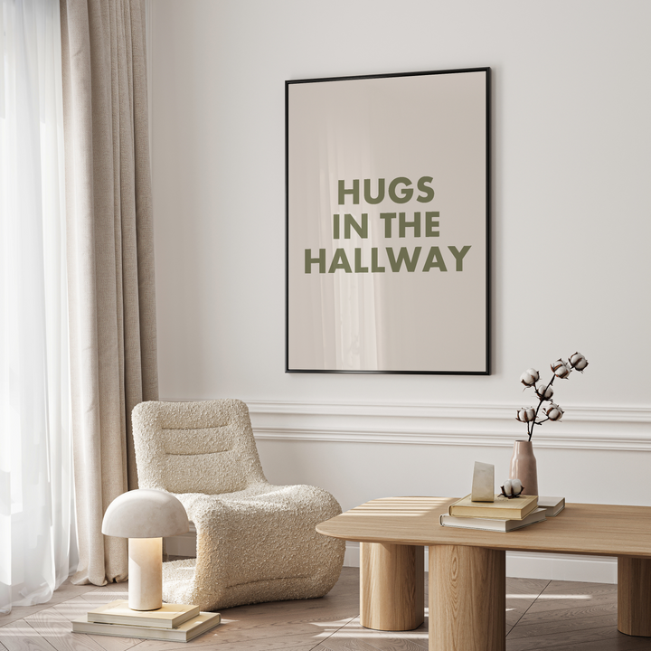 Modern living room with a chair, table, and framed artwork on the wall.