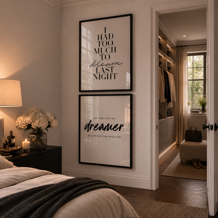 Modern bedroom with framed artwork on the wall and a well-lit closet.