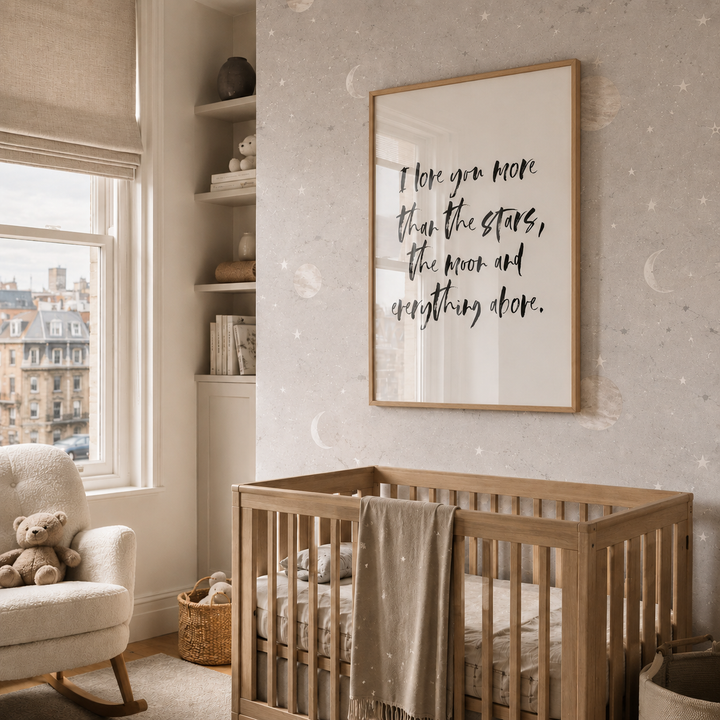 Nursery room with wooden crib, teddy bear, and framed quote on wall.