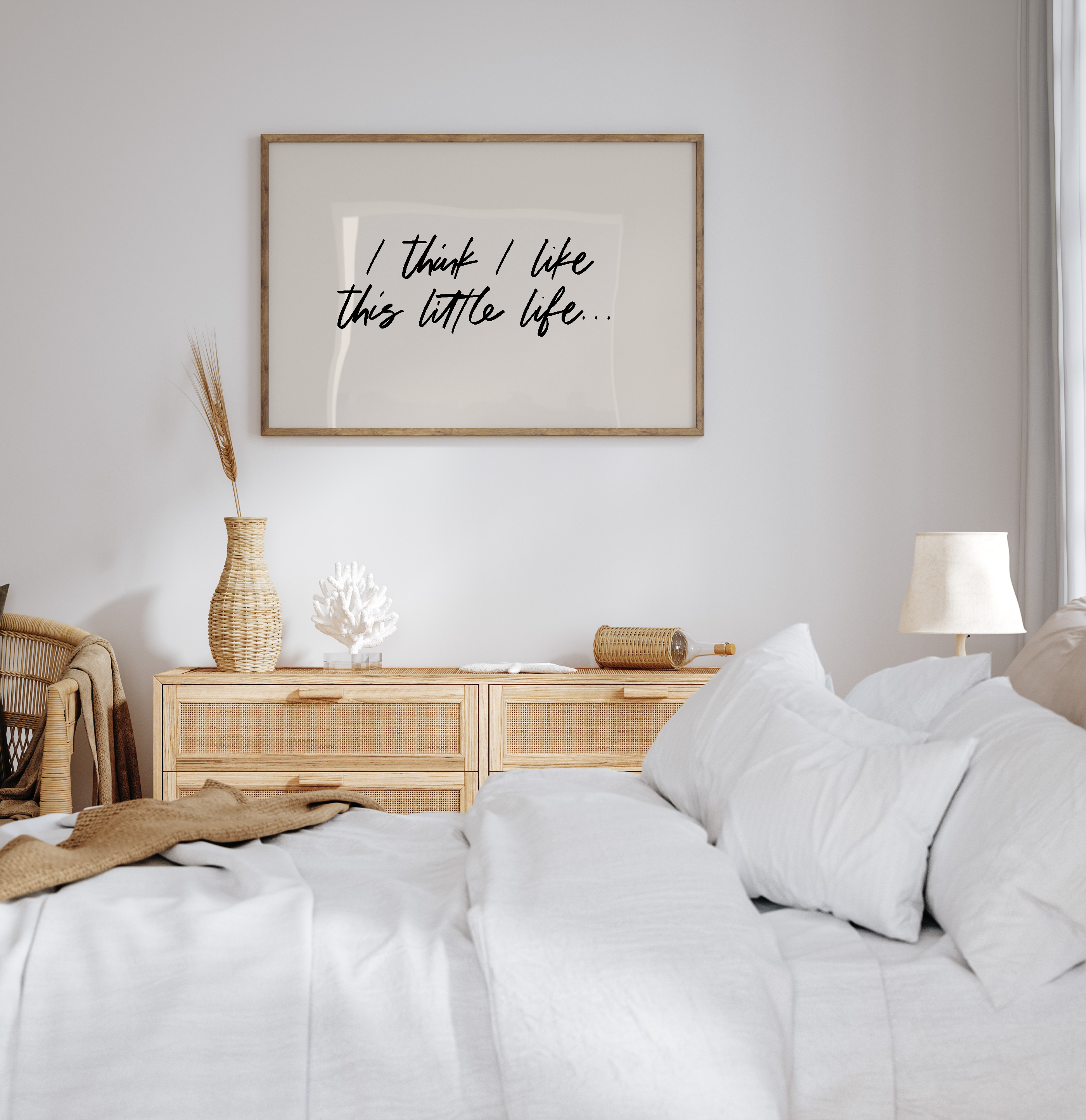 Bedroom with a bed, nightstands, and wall art with text.