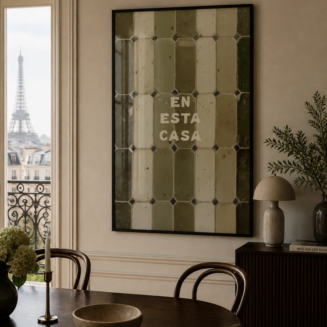 Dining room with a large mirror on the wall featuring text, a view of the Eiffel Tower, and a lamp.