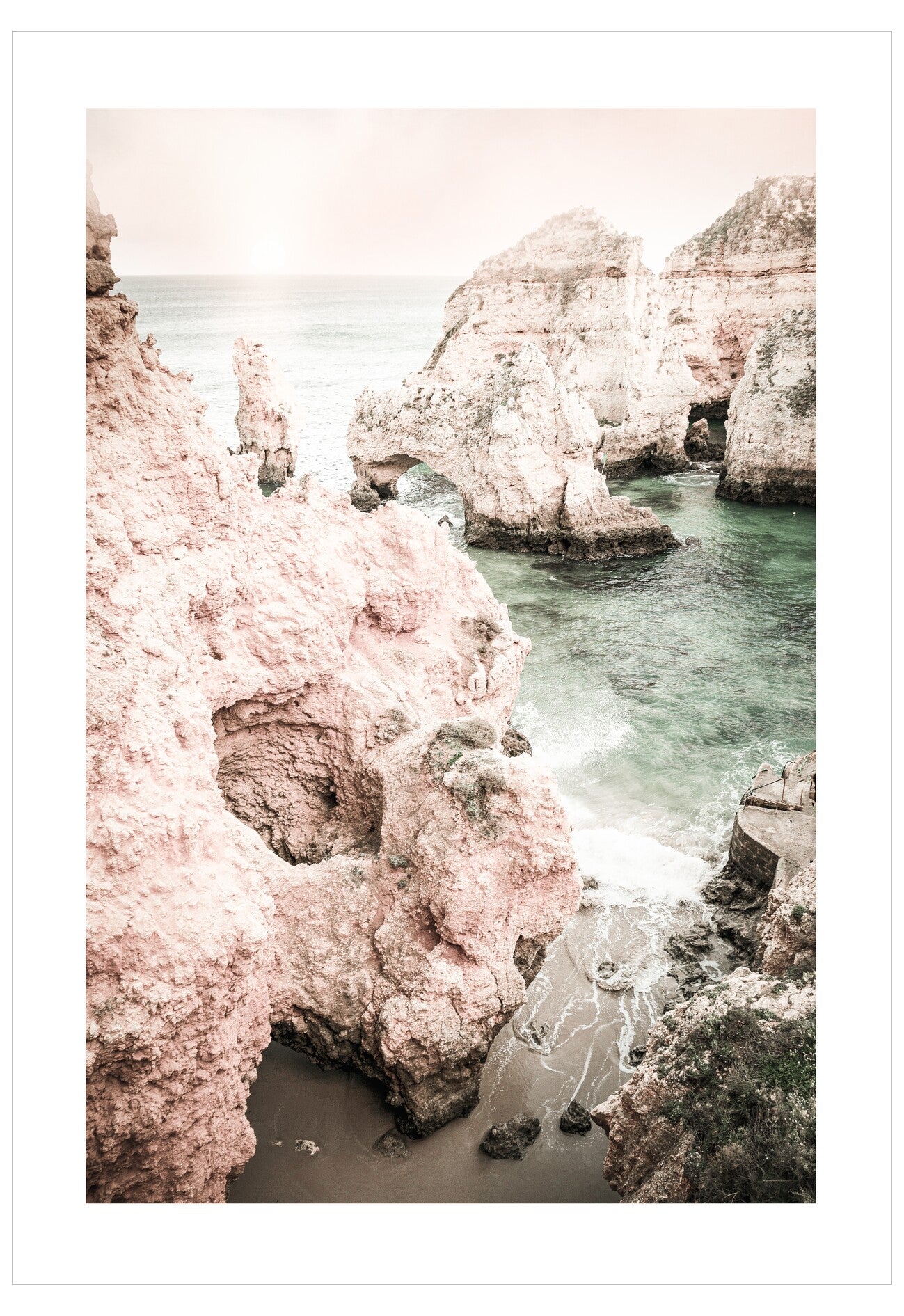 Rocky coastline with pinkish cliffs and turquoise water
