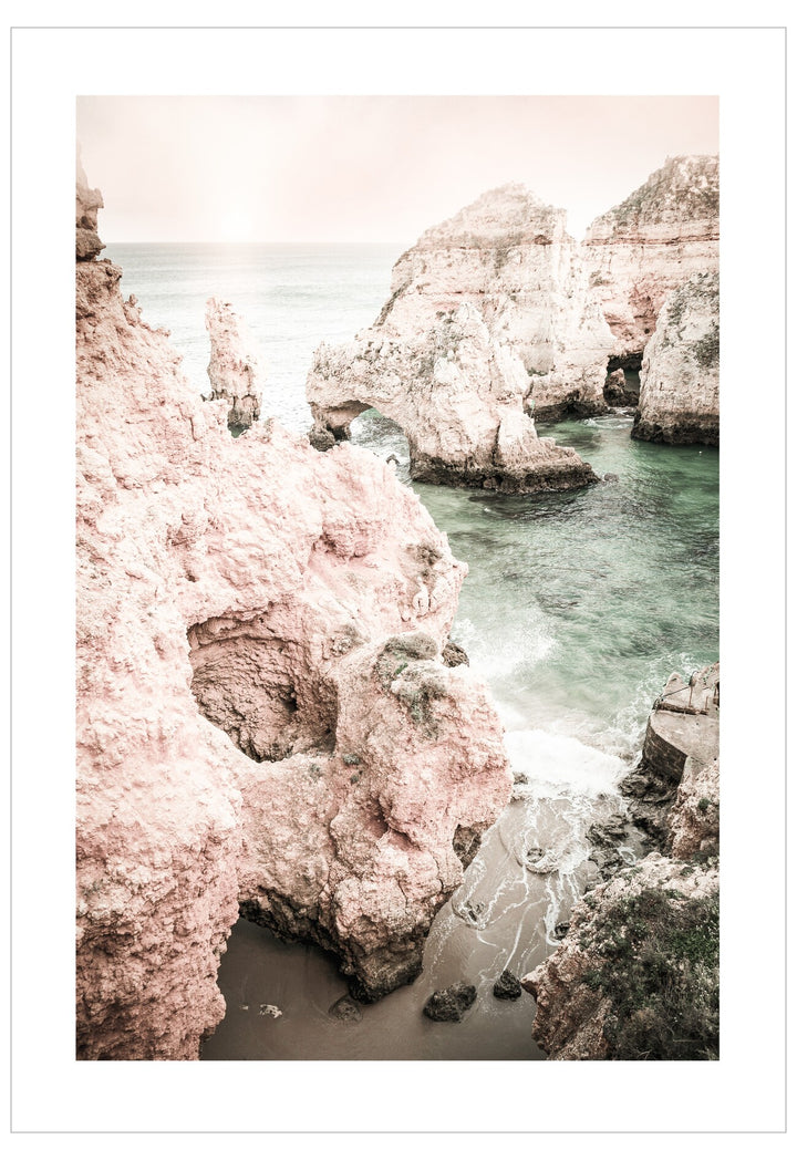Rocky coastline with pinkish cliffs and turquoise water