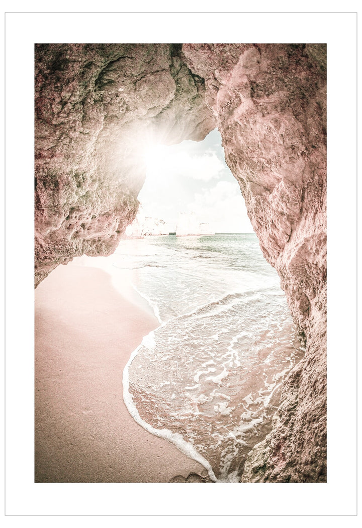 Rocks on a beach with waves crashing against them