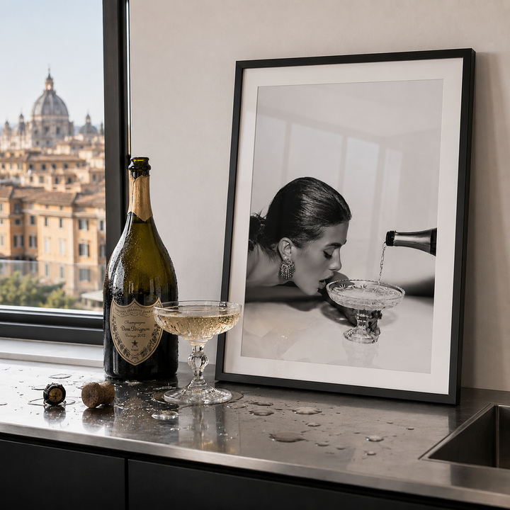 Large bottle of expensive champagne next to champagne black and white kitchen wall art in modern kitchen