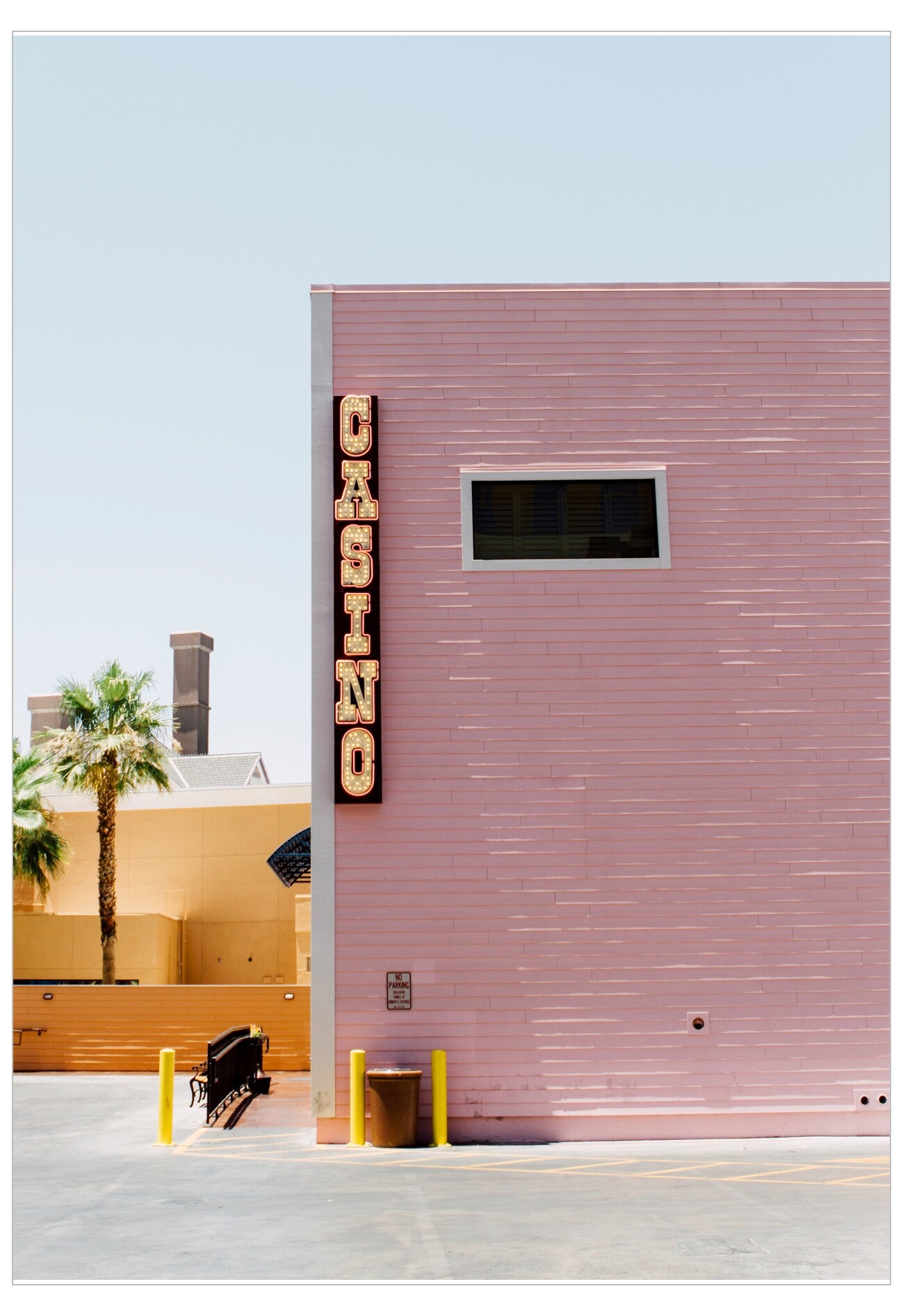 Pink building with a 'Casino' sign on a clear day