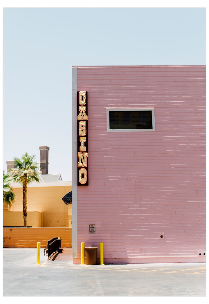 Pink building with a 'Casino' sign on a clear day