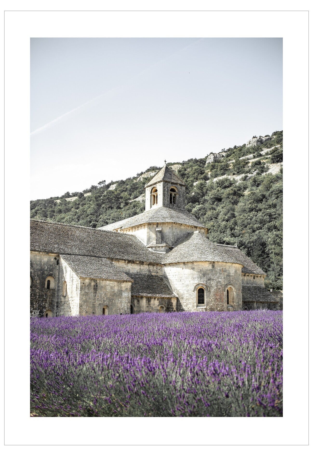 Monastery surrounded by lavender fields with mountains in the background
