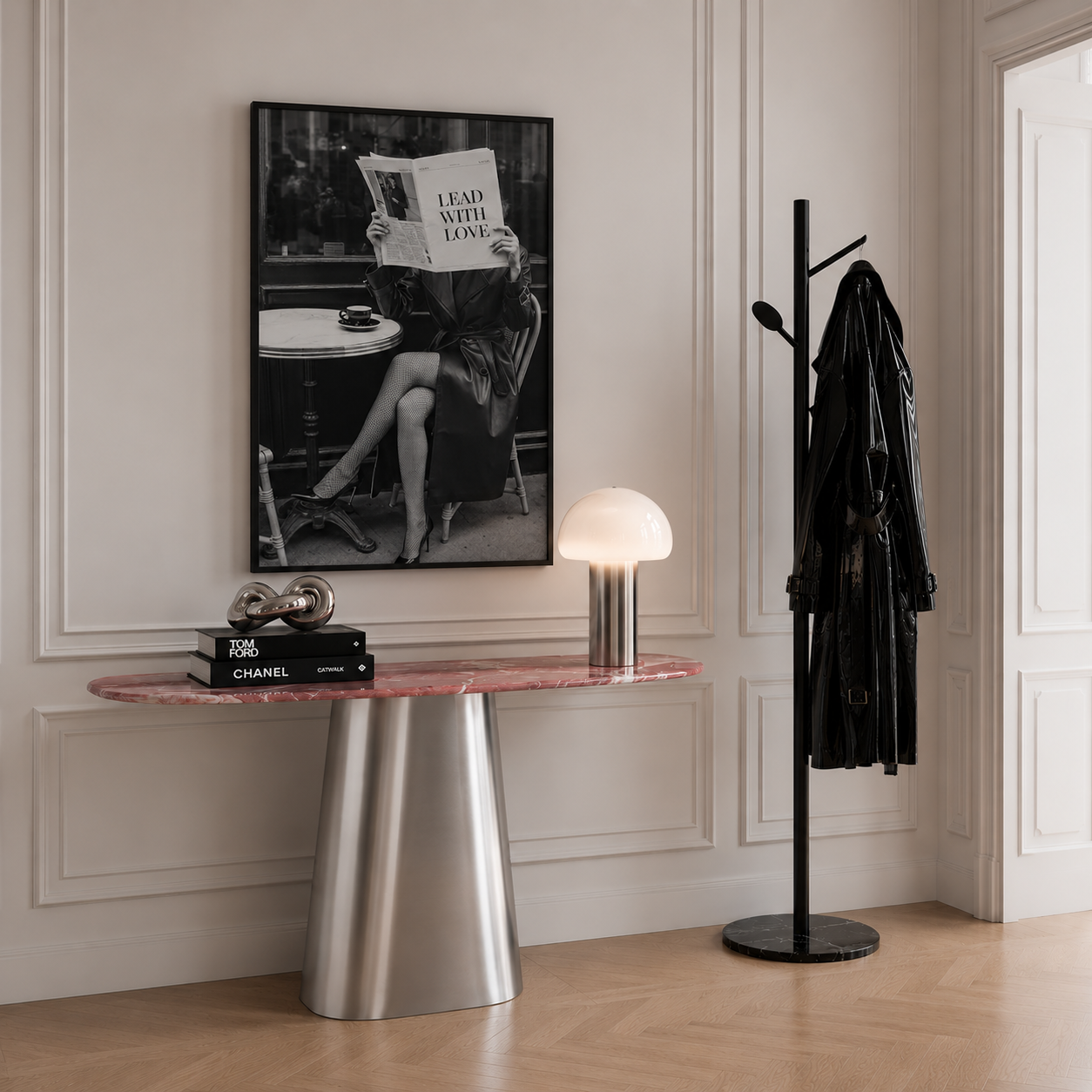 Black and white photography art in stylish hallway above stainless steel and pink marble console table