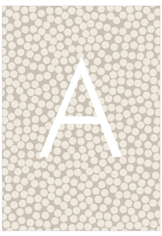 Beige background with white polka dots and a white letter 'A'.