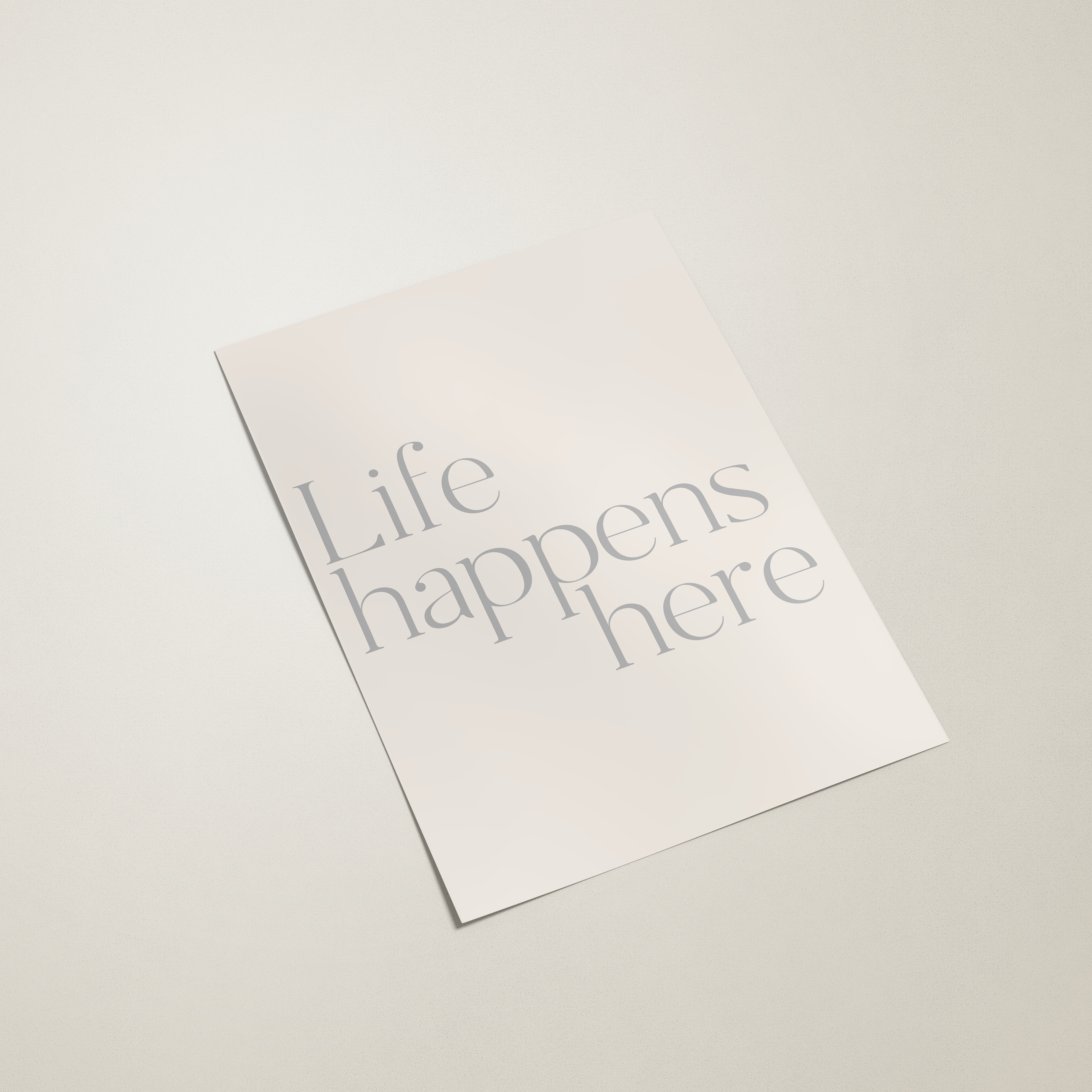 White paper with 'Life happens here' text on a light gray background