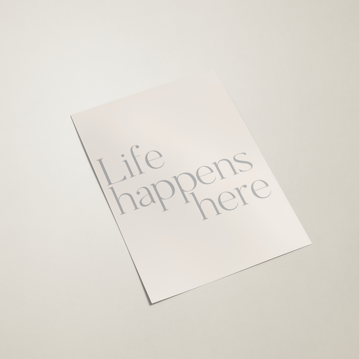 White paper with 'Life happens here' text on a light gray background