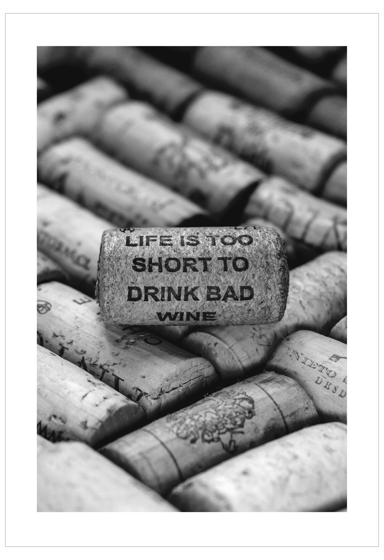 Wine corks with a cork featuring 'Life is too short to drink bad wine' text.