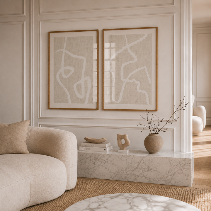 Modern neutral scandi style living room with abstract art, a sofa, and decorative items.