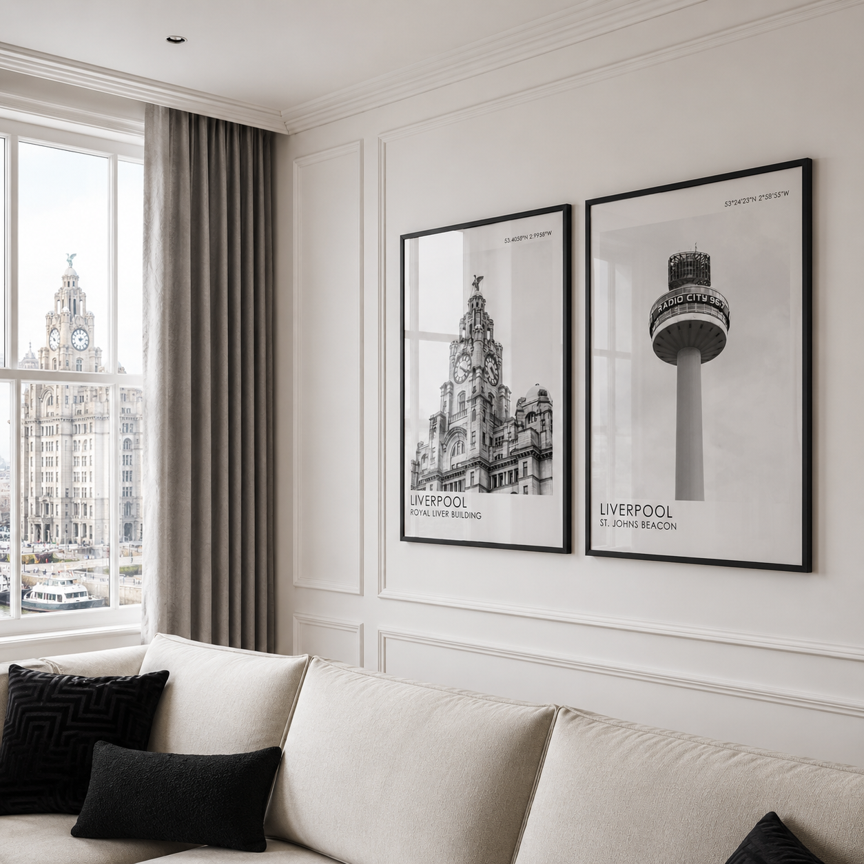 Living room with a sofa, black pillows, and framed pictures of Liverpool landmarks.