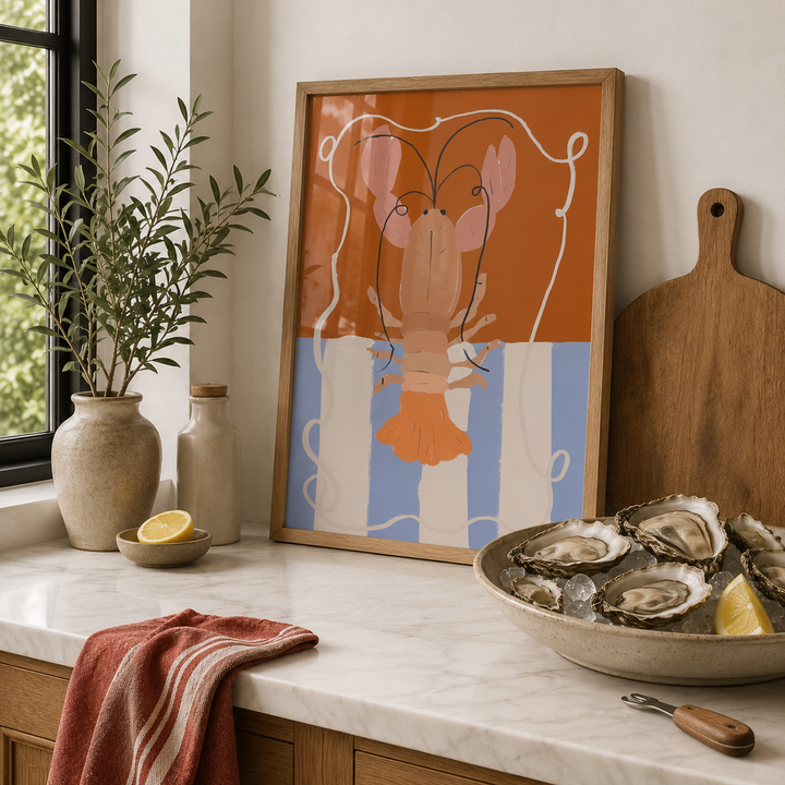 Kitchen counter with oysters, a lobster painting, and a cutting board.