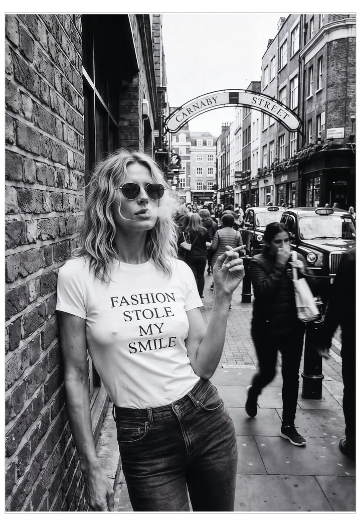 Woman wearing a t-shirt with 'Fashion Stole My Smile' on a street in London.