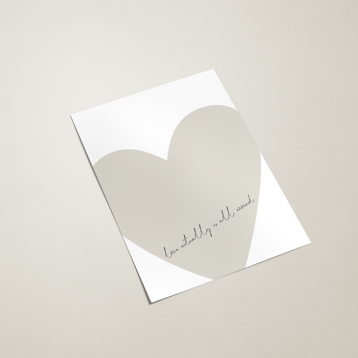 White card with a heart design and text on a beige background