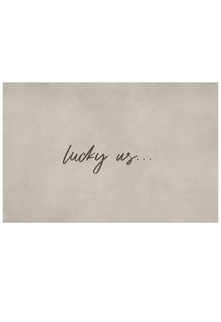 A rectangular beige luxury wall art with the words 'lucky us.