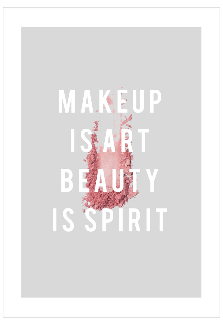 Motivational quote 'Makeup is art, beauty is spirit' with pink makeup powder on a gray background
