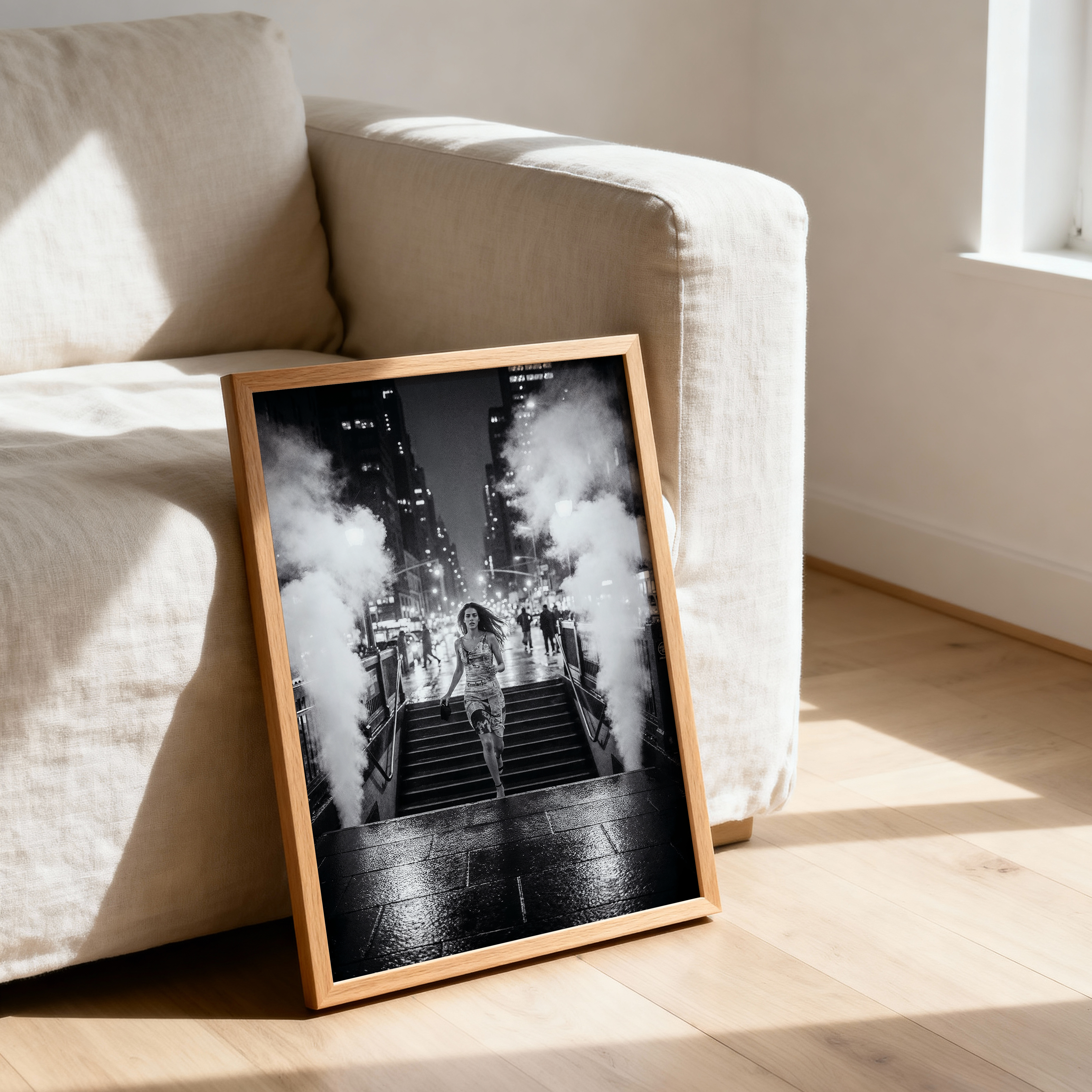 a framed picture of a woman crossing a street on the floor.