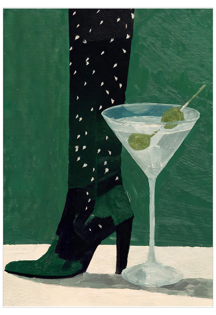 Black high-heeled shoes with green soles next to a martini glass with olives on a green background