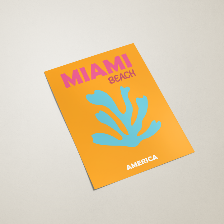 Poster with 'Miami Beach America' design on an orange cover.