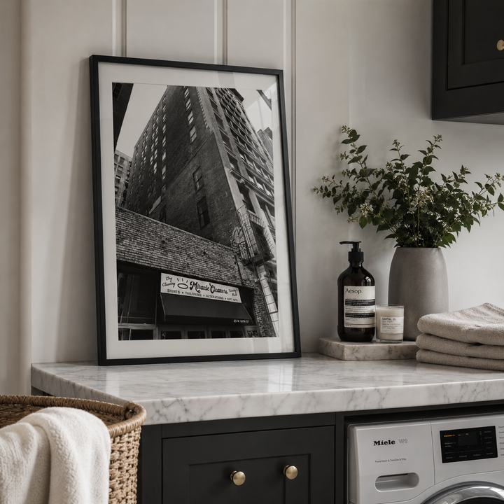 Black and white laundry poster in a luxury utility room. 