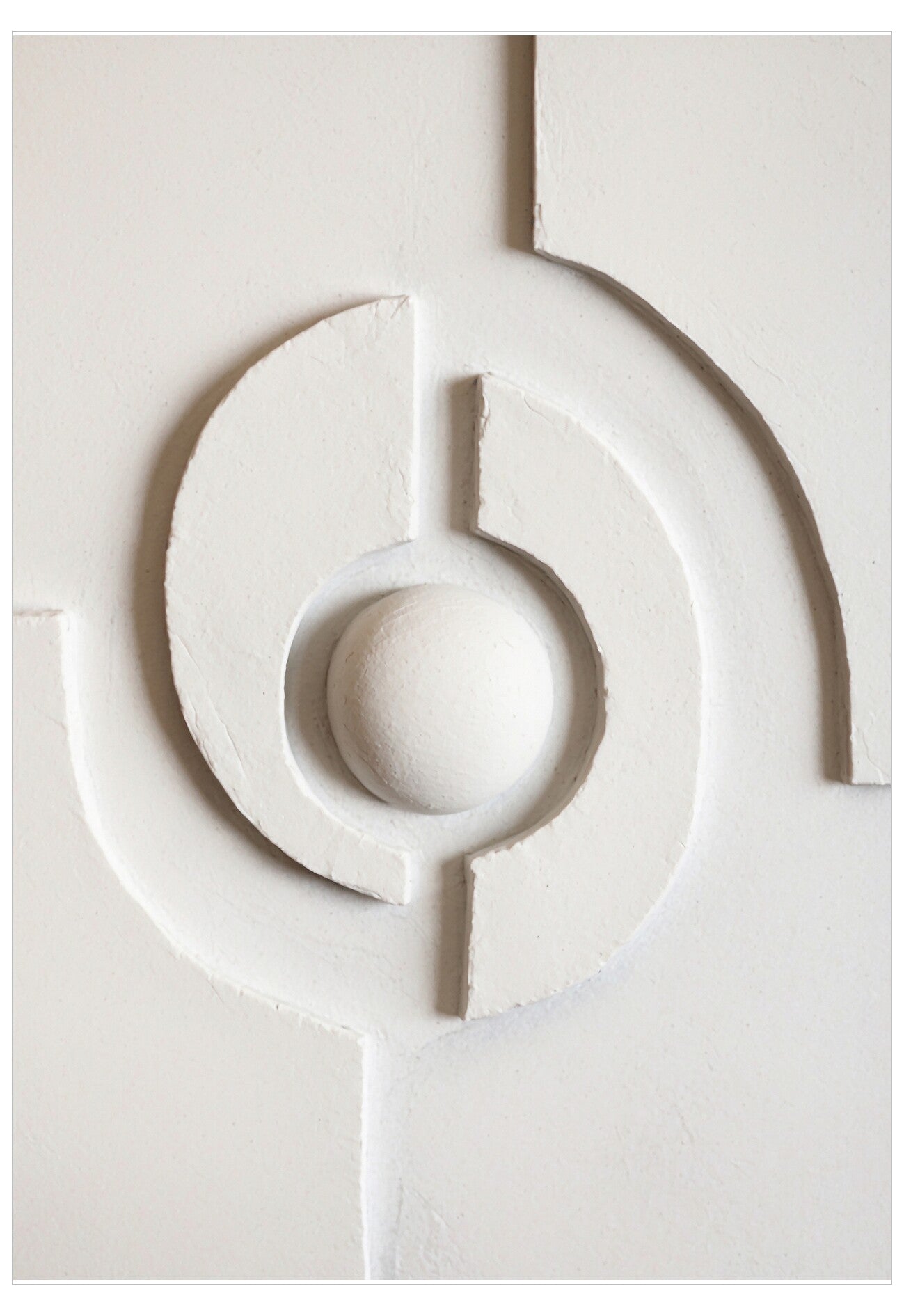 Decorative white wall panel with circular design