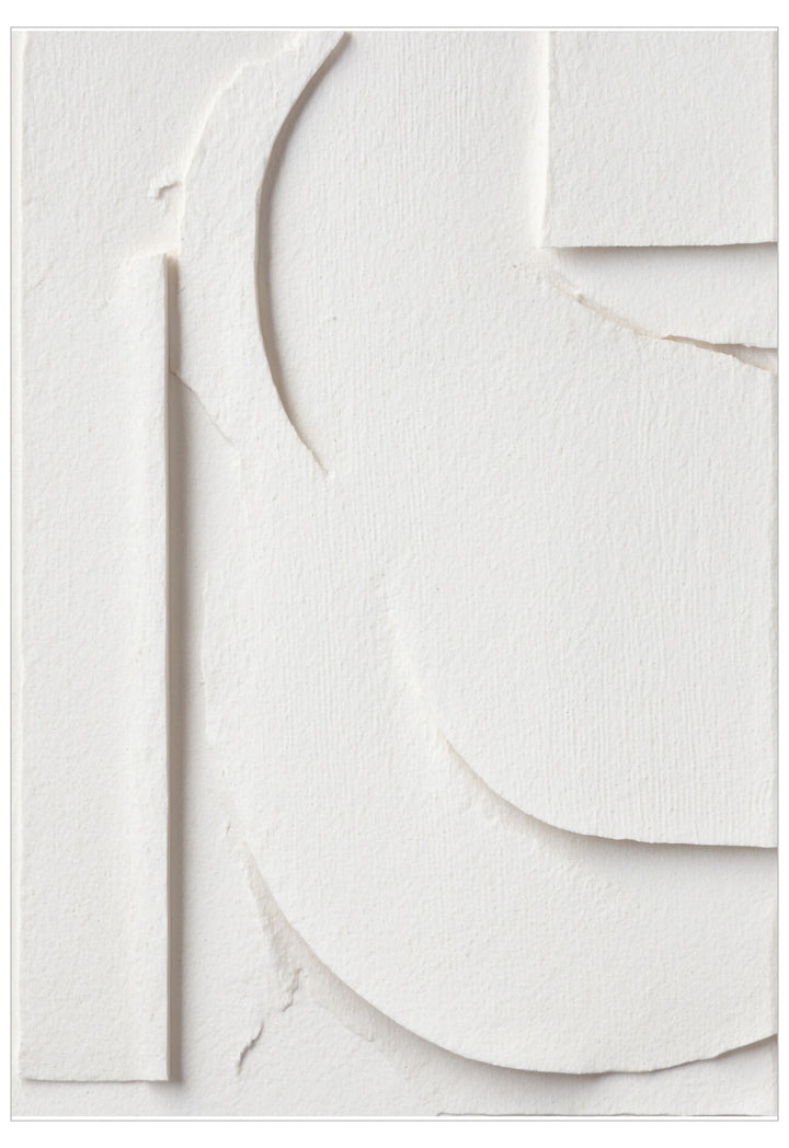 Stack of white circular paper cutouts on a light gray background