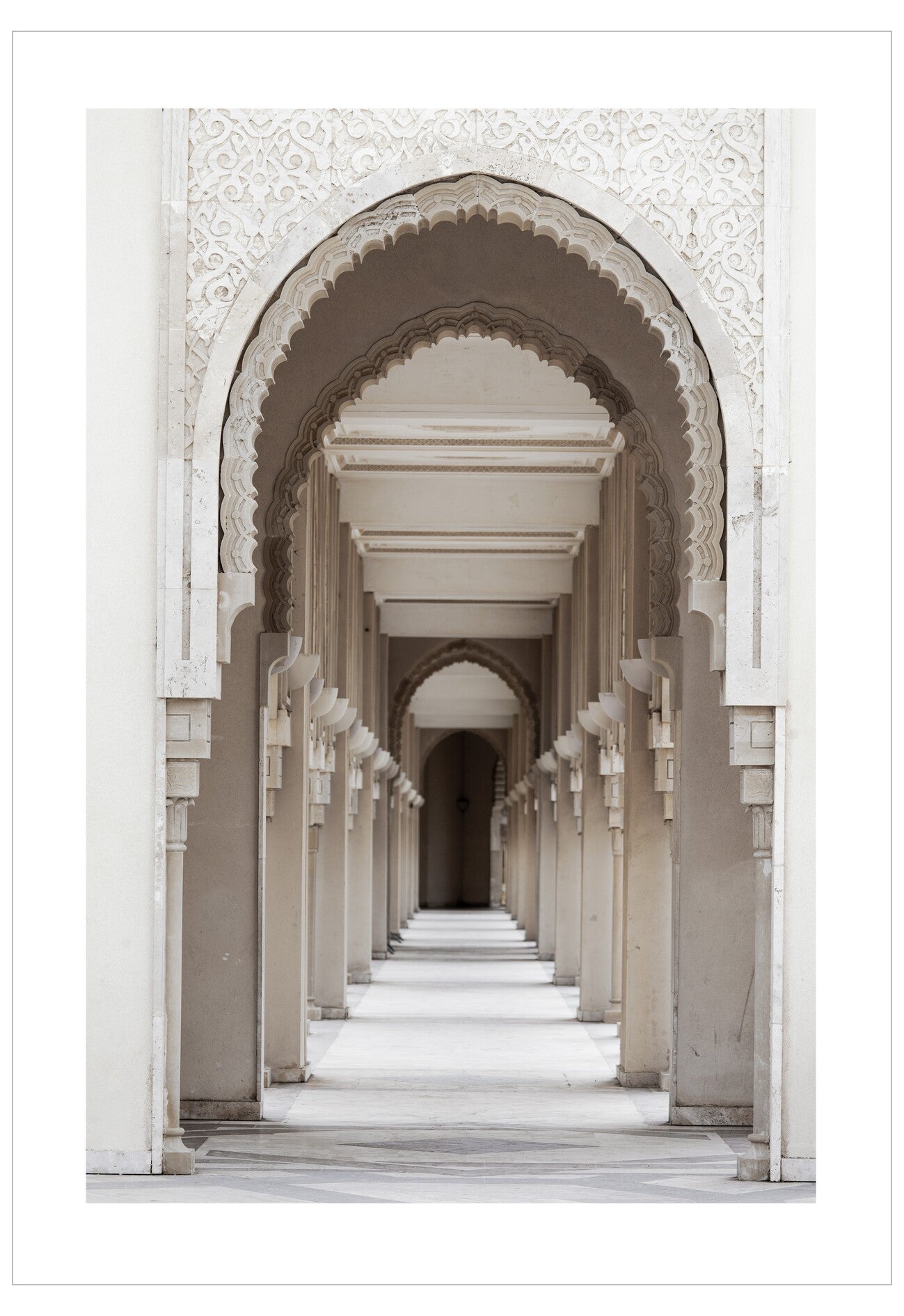 Long corridor with arched passageways and white marble floors