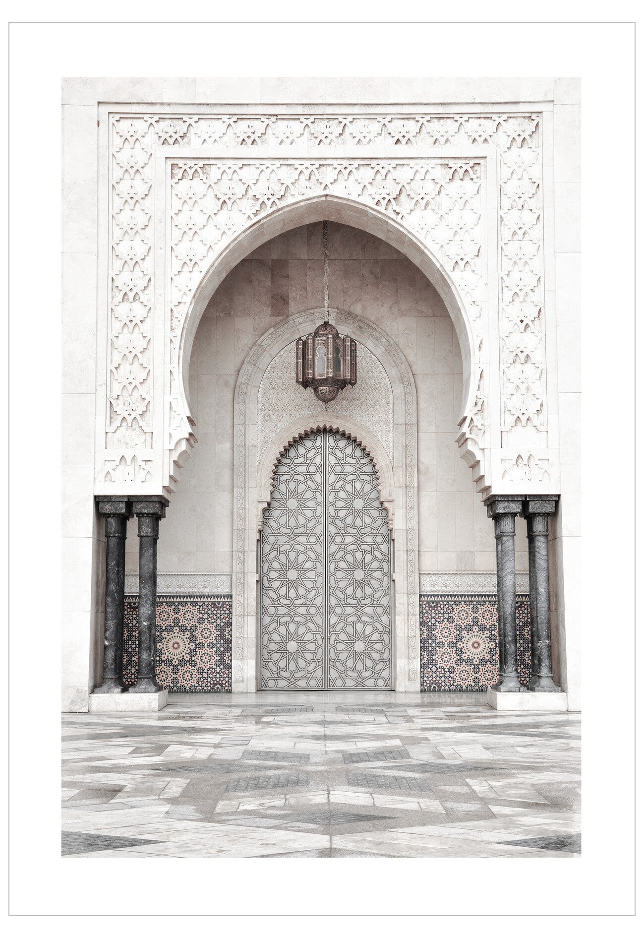Arabesque archway with intricate patterns and a hanging lantern in a mosque.