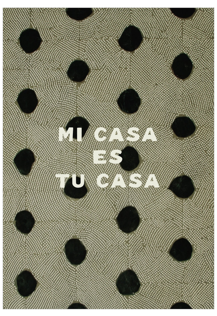 Text 'MI CASA ES TU CASA' on a patterned fabric background