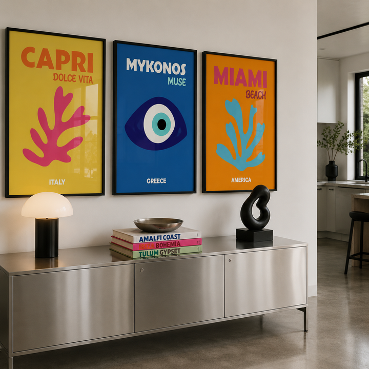 Modern interior with decorative posters on a wall above a metallic console table.