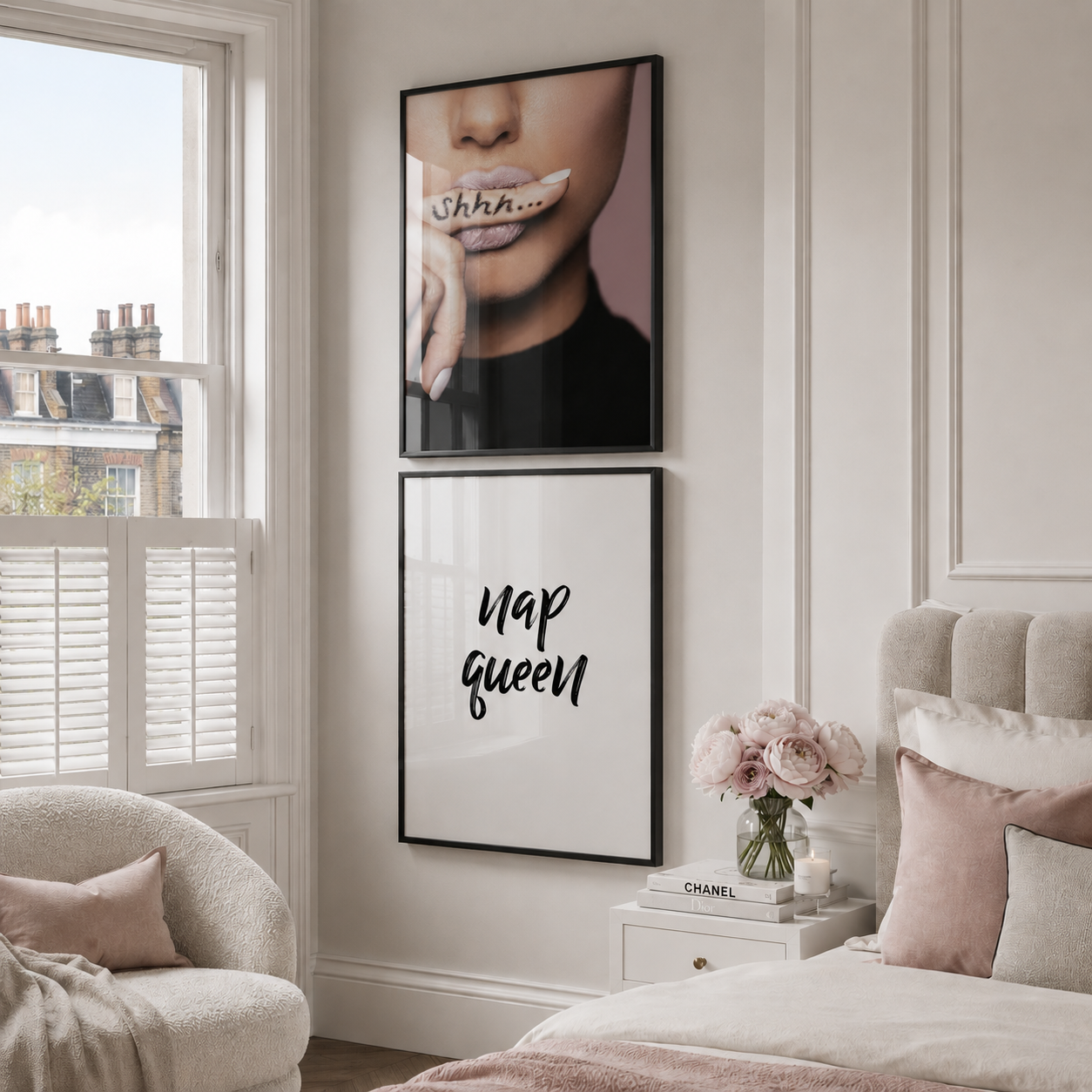 Decorative bedroom with framed art and a vase of flowers on a nightstand.