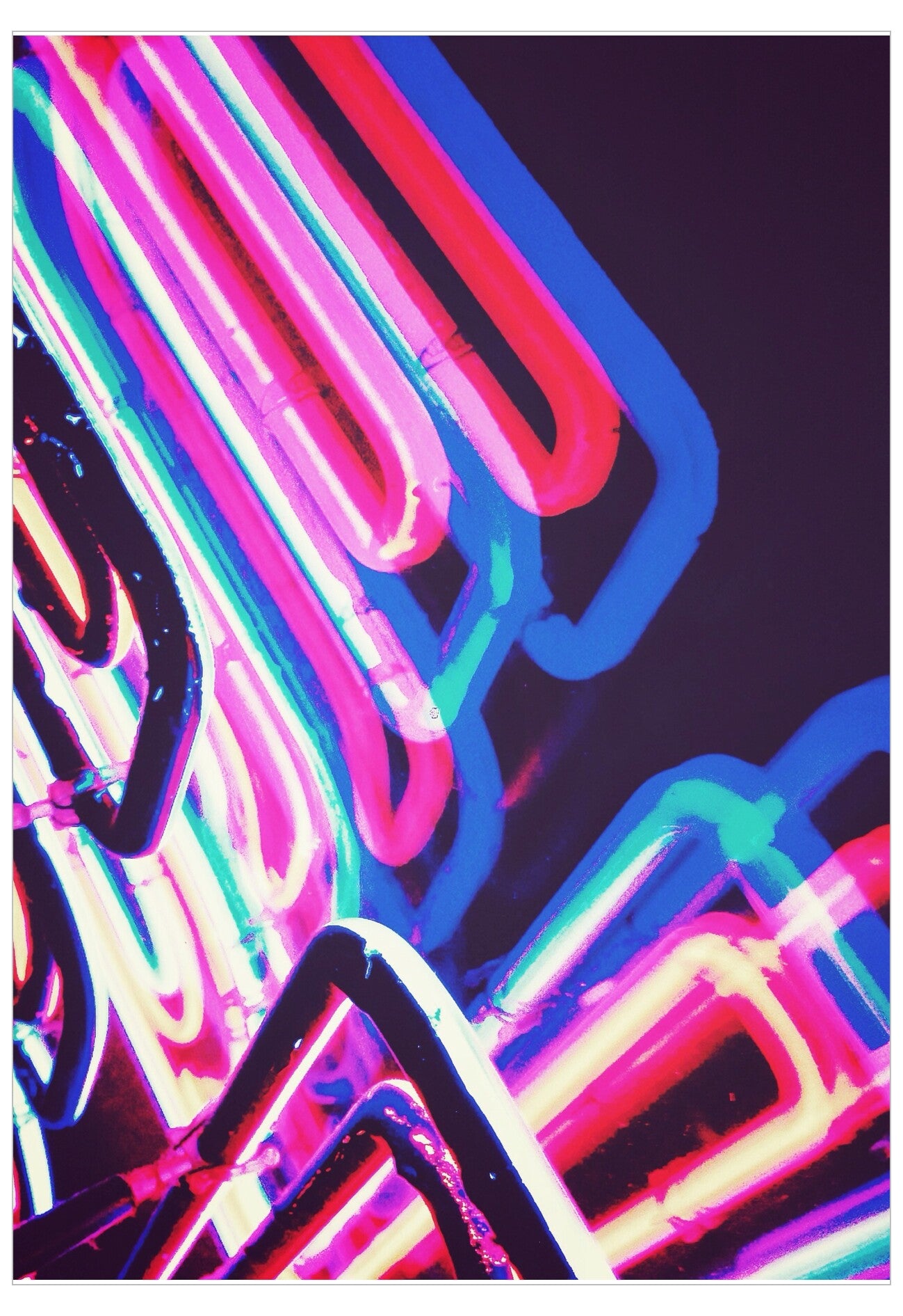 Neon lights in pink, blue, and purple on a dark background