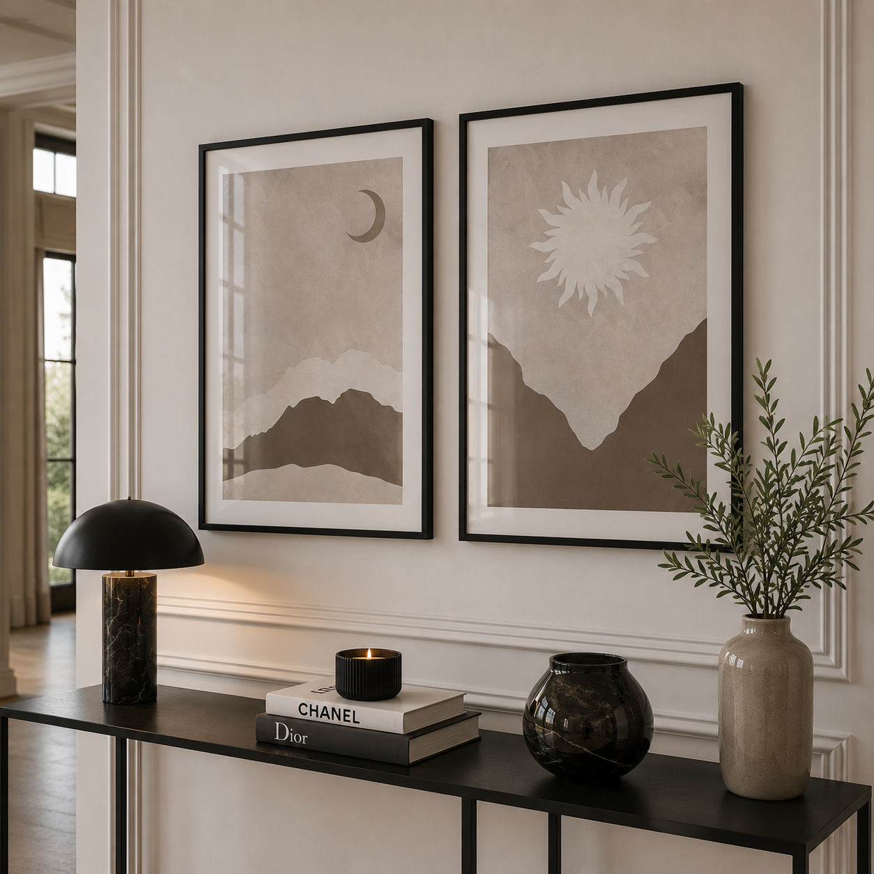 Modern interior with framed artwork, books, and decorative items on a console table.